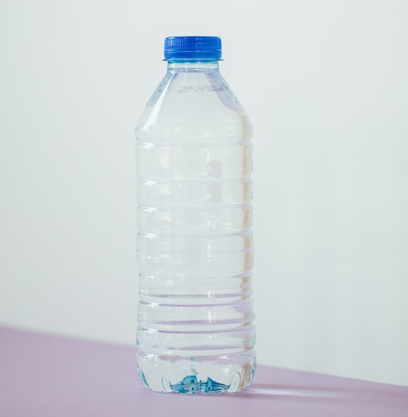 clear plastic bottle on white table