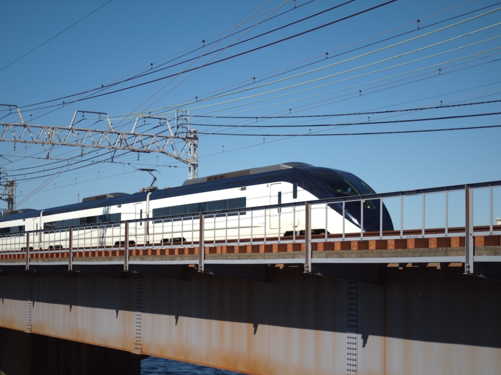 white and black train on rail tracks during daytime